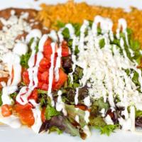 Enchiladas Supreme · One ground beef, one shredded chicken, and one cheese enchilada each stuffed in a corn torti...