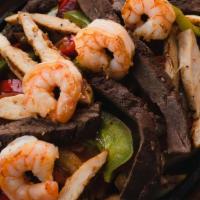 Cantina Fajitas · Chicken breast, shrimp, and skirt steak.  All fajitas come with grilled onions,  bell pepper...