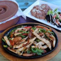 Chicken Fajitas · All fajitas come with grilled onions, bell peppers, and tomatoes. Served with a side of rice...
