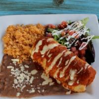 Chimichanga · A fried flour tortilla stuffed with shredded chicken and topped with red sauce and queso dip...