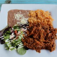 Carnitas · Marinated pork tips. Served with a side of rice, refried beans, side salad (lettuce, sour cr...