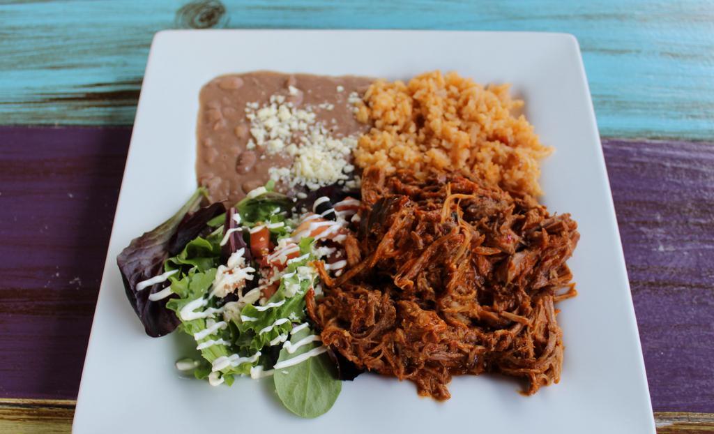 Carnitas · Marinated pork tips. Served with a side of rice, refried beans, side salad (lettuce, sour cream, tomatoes, queso fresco), and three flour tortillas. Ask your server if you would like it served Colorado style with our signature al pastor salsa.