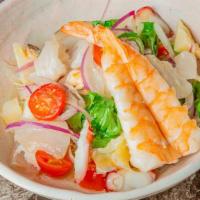 Seafood Ceviche · Mix raw fish & tomato greens in ceviche sauce.

Raw items included.