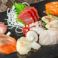 Sashimi Regular · 12 p chef's choice sashimi.

Raw items included.