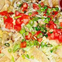 Nachos · Fresh tortilla chips topped with creamy queso, salsa, sour cream shredded lettuce, pico de g...