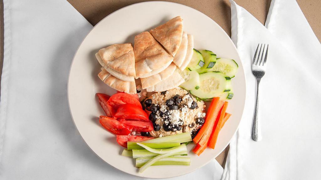 Hummus Platter · Served with fresh carrots, celery, black olives, tomatoes, cucumbers, pita bread and feta cheese.