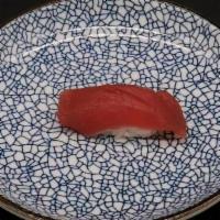 Tuna Nigiri (1 Piece) · Slice of tuna on a ball of sushi rice.