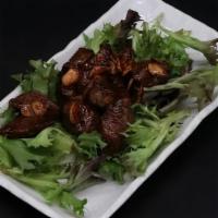 Diced Steak · Diced Flank Steak with garlic, Yakko-San's barbeque sauce, on bed of spring mix.