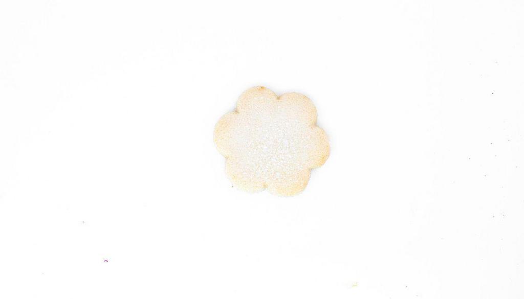My Sister'S Sugar Cookie · A soft and sweet sugar cookie, lightly flavored with almond. Dipped in vanilla glaze and topped with crunchy decorating sugar (nut allergen)