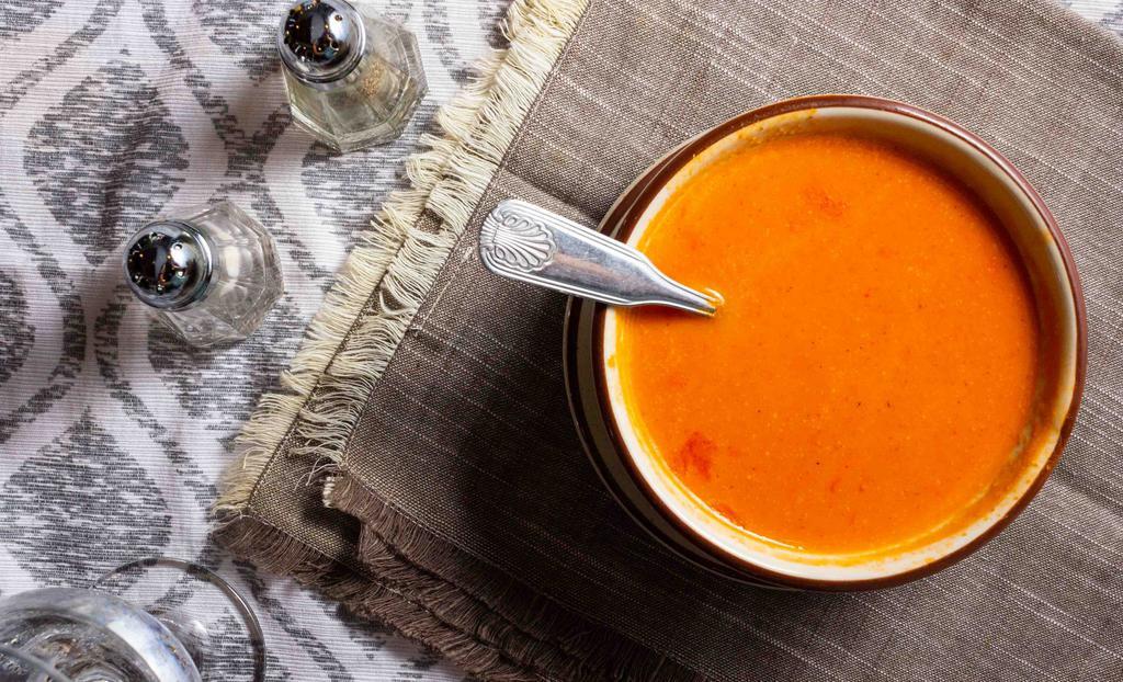Tomato Soup · Tomatoes blended with a hint of cream and herbs and spices.