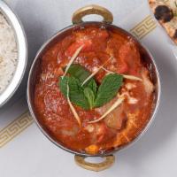 Chicken Tikka Masala · Charcoal broiled chicken in moderately spiced creamy sauce.
