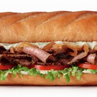 Prime Rib Steak Sub, Large (11-12 Inch) · Seared and slow-roasted prime rib, melted provolone cheese and caramelized onions with garli...