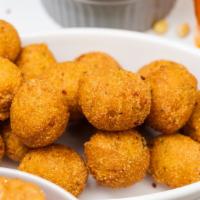 Hushpuppies · Deep-fried flavorful balls of seasoned cornmeal & spices!