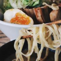 Momonoki Tsukemen · Pork & fish broth, seared pork belly, ramen egg, nori, white cabbage, scallions. (contains f...