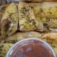 Garlic Bread · French hoagie roll brushed with garlic butter and parmesan, served with a side of marinara.