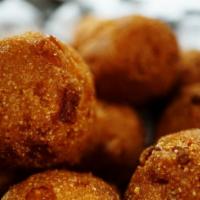 Hush Puppies (10 Pcs) · Deep fried hush puppies with a sweet dipping sauce.