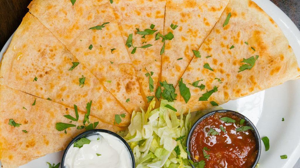 Chicken Quesadilla · Grilled flour tortilla stuffed with chicken and cheddar jack cheese. Served with sour cream and signature salsa. 890 cal.