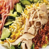Chef Salad · Sliced turkey and ham, smoked bacon, cheddar jack cheese, chopped tomatoes and cucumbers ove...