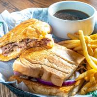 Prime Rib Garlic Melt · Prime rib, sliced onions and provolone cheese served hot and pressed on garlic Cuban bread. ...