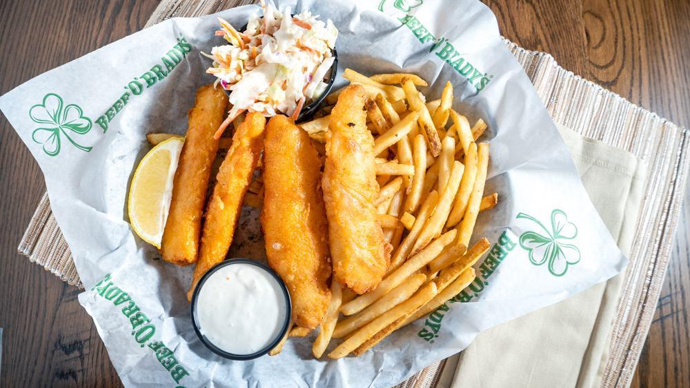 Fish & Chips · Four delicious beer-battered cod fillets fried golden brown and served with tartar sauce, fresh lemon, fries, and creamy coleslaw.