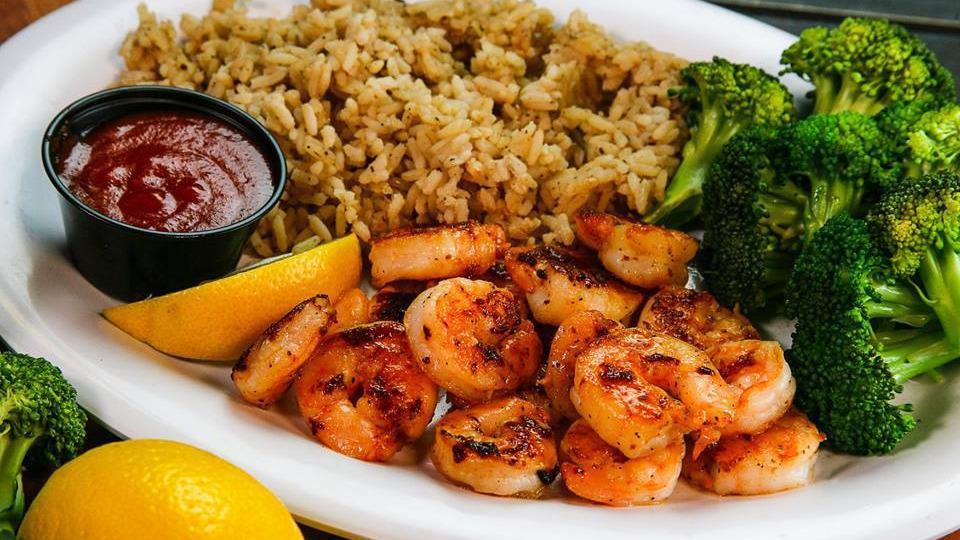 Grilled Shrimp Dinner · BEST VALUE! 16 juicy shrimp grilled or blackened and served with steamed broccoli, seasoned rice, cocktail sauce and fresh lemon. (570-605 Cal)