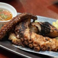 Pulpo A La Parrilla · Grilled octopus seasoned with red Peruvian pepper and olive oil.