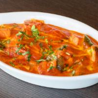 Butter Chicken  · Boneless chicken breast poached with creamy tomato sauce and served with basmati rice.