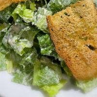 Caesar · Fresh romaine lettuce, parmesan cheese, croutons & homemade dressing.