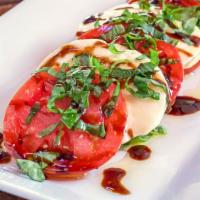 Caprese Salad · Fresh tomato, fresh mozzarella, basil, olive oil, and balsamic glaze.