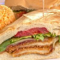 Crispy Chicken Cuban Club · Golden breaded chicken cutlets, applewood smoked bacon, Swiss cheese, lettuce, tomato, and j...