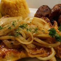Pechuga De Pollo A La Plancha · Chicken breast marinated with citrus juice, garlic mojo, and topped with grilled onions.
Ser...