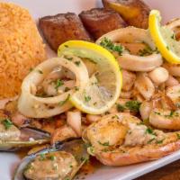Parrillada De Mariscos · Jumbo shrimp, calamari, mussels, octopus, and fish of the day on the grill, marinated in gar...