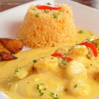 Filete De Corvina Imperial · Golden sea bass fillet, grilled, topped with shrimp, and scallops. Cooked in a delicate crea...