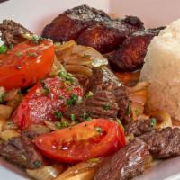 Lomo Saltado · Sirloin strips of steak with tomato, onion, cilantro, and soy sauce sauteed in a fiery wok. ...