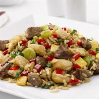 Arroz Chaufa · Peruvian style stir fried rice with chicken or steak strips sauteed with scallion onions and...