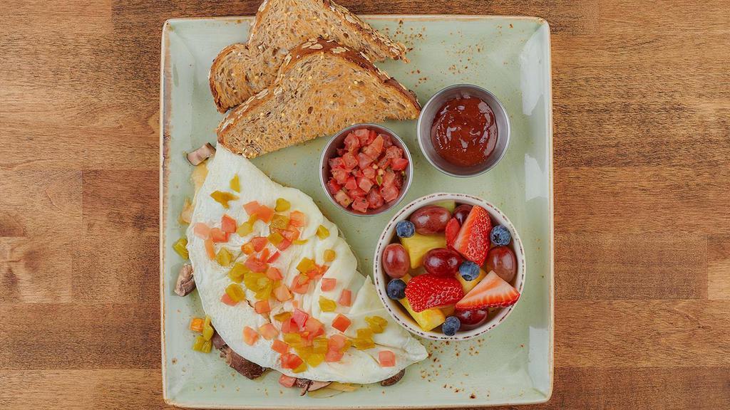 Tri-Athlete · Egg white omelet with house- roasted Crimini mushrooms, onions, tomatoes and green chilies. Served with housemade pico de gallo, dry whole grain artisan toast, all-natural house preserves and fresh fruit.