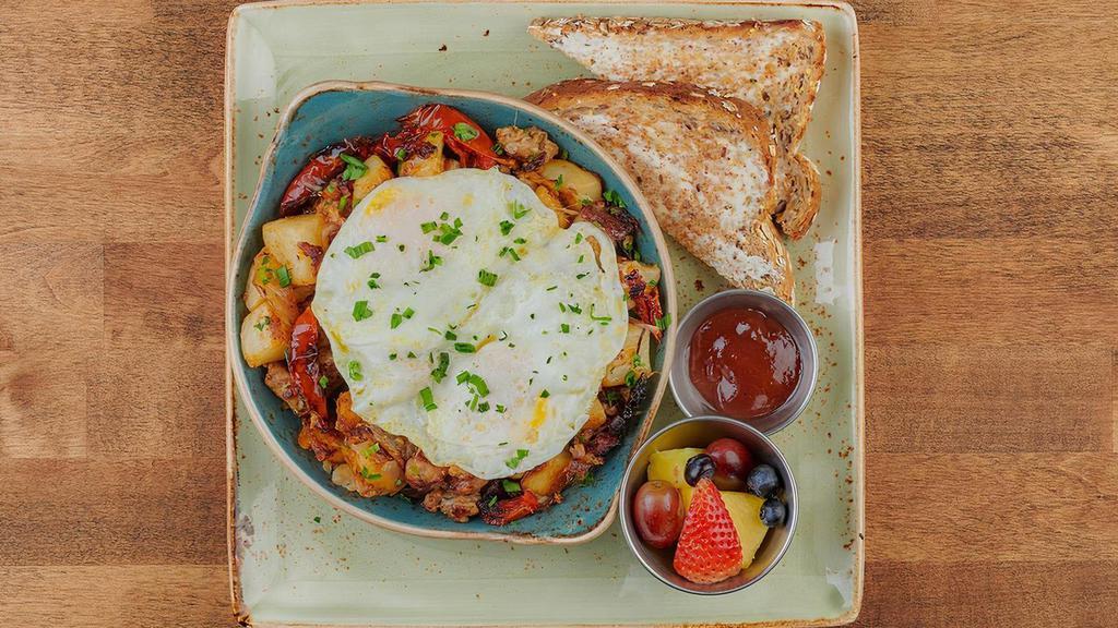 Parma Skillet Hash · Two cage-free eggs any style atop seasoned potatoes, Italian sausage, house-roasted Crimini mushrooms, onions and tomatoes with melted Parmesan, Mozzarella and fresh herbs. Served with whole grain artisan toast with all-natural preserves.. *Please note: Our potatoes are cooked with onions. We are unable to accommodate onion removal requests for dishes containing potatoes.