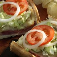 Johnny’S Special Sub/Wrap · Ham, salami, capicolla, mayo, mustard, lettuce, tomatoes, onions, provolone cheese & Italian...