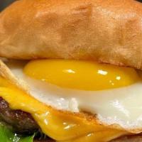 Eggin Burger · Our 100% fresh beef patty topped with American cheese, lettuce, tomato, a fried egg and our ...
