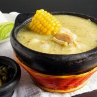 Ajiaco · Colombian chicken soup. It comes with rice and avocado.