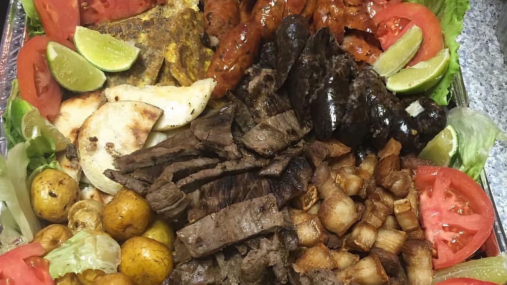 Picada Ajiacos (2Pp) · Steak, chicken, fried pork, sausage, blood sausage, fried plantain, colombian potatoes, arepa and tomato.