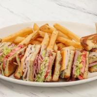 Classic Club Sandwich · Sourdough bread, roasted red pepper mayo, Sharp cheddar, applewood-smoked bacon, lettuce, to...