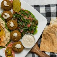 Falafel Platter · Five falafel served with hummus, tabbouleh, pickles and tahini sauce plus one pita bread. Ad...