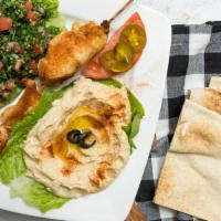 Chicken Kabob · Chicken served over lettuce and tomato with hummus and tabbouleh including one pita bread