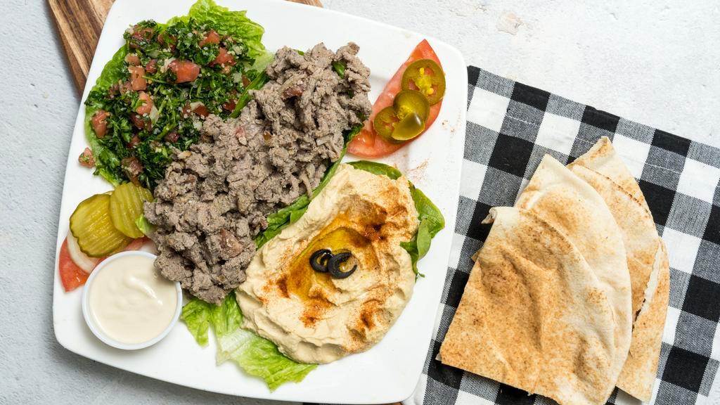 Shawarma Platter · Hummus, tabbouleh, pickles, tahini sauce and one pita bread. Add extra pita for an additional charge.