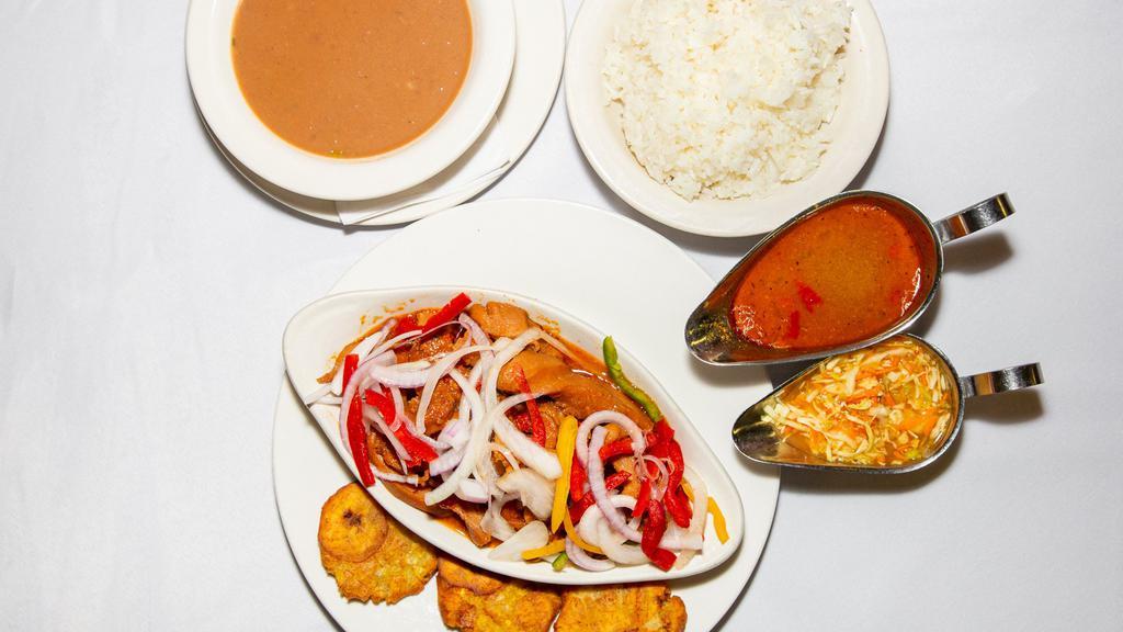 Lambi /Conch · Served in creole sauce with salad, rice & plantains