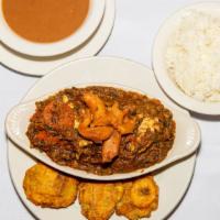 Seafood Legumes / Aubergine Au Fruits De Me · Eggplant with crab & conch, served with rice & plantains