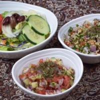 Shirazi Salad · Vegetarian. Diced tomatoes, cucumbers, and onions.