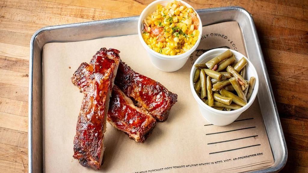 1/4 Rack Of St. Louis Style Ribs + 2 Sides · Seasoned with 4R All Purpose Rub,  smoked and finished with a Honey BBQ sauce. Comes with 2 sides.