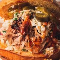 Messy Pig · Heaping pile of pulled pork between 2 layers of Southern Coleslaw, topped with pickles and j...